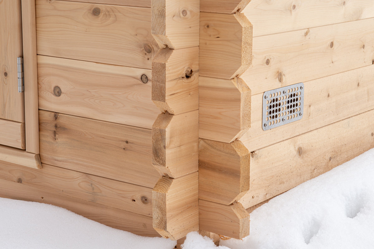 Close-up view of the exterior wall details of a Leisurecraft Canadian Timber Granby Cabin Outdoor Sauna.