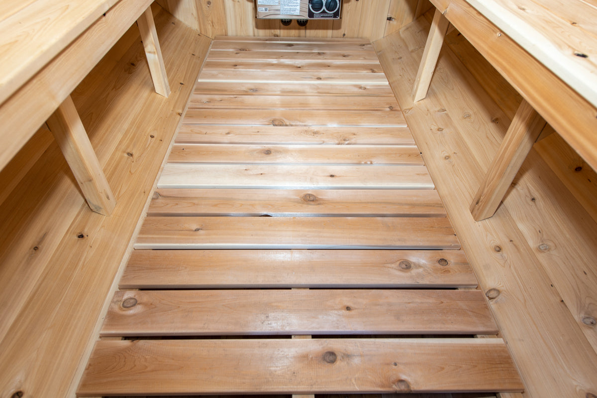 Close-up view of the floor of Leisurecraft Canadian Timber Harmony Barrel Sauna.