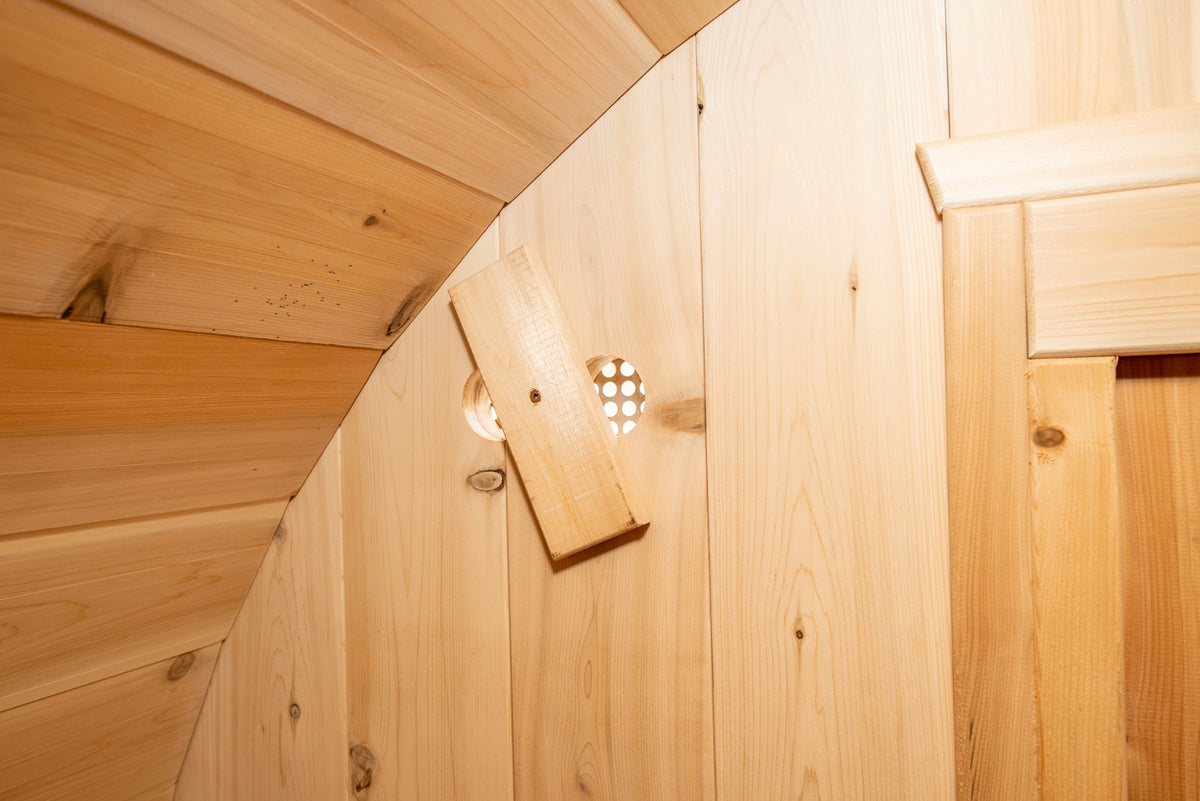 Close-up view of interior details of Leisurecraft Canadian Timber Harmony Barrel Sauna.