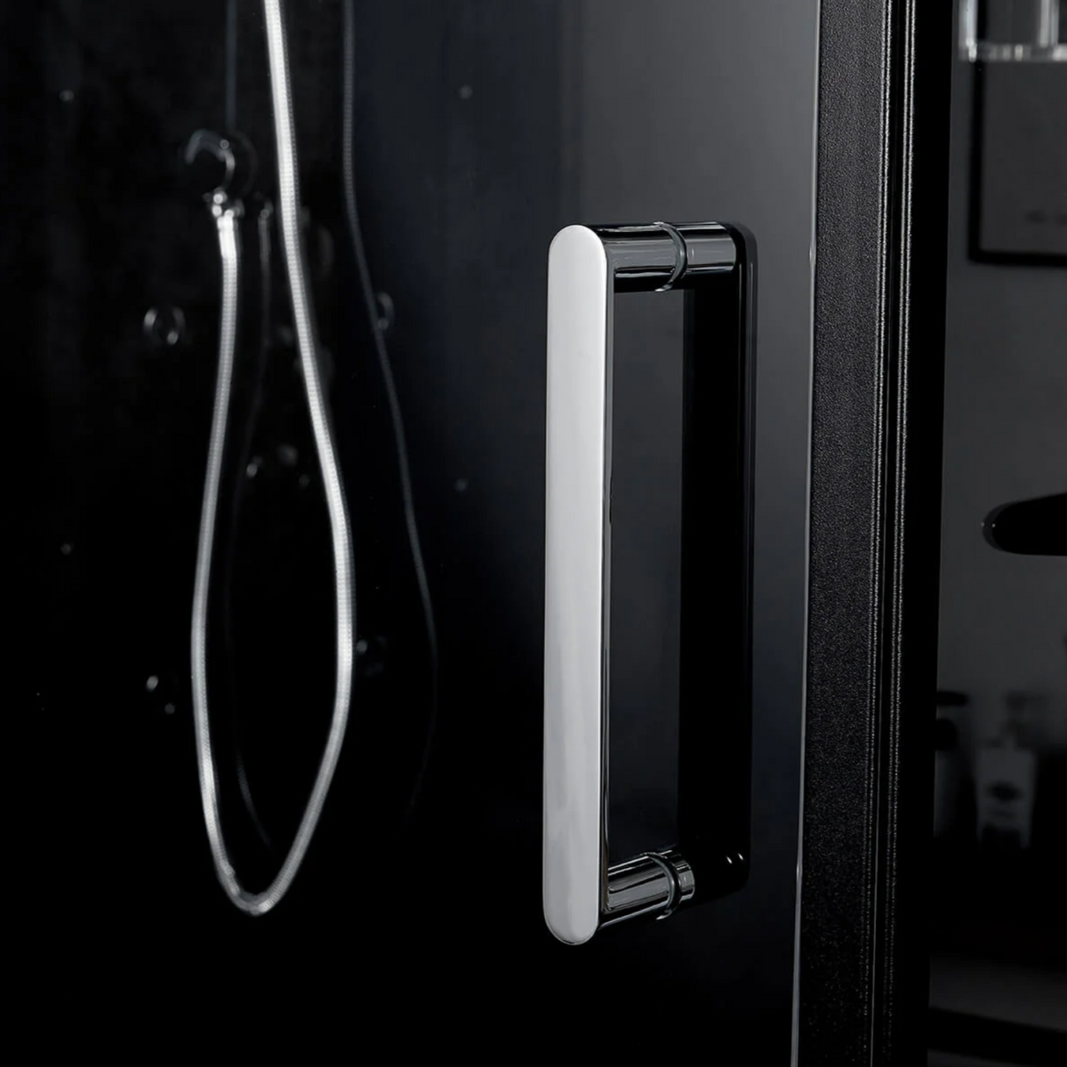 Close-up view of door handle of Maya Bath Anzio Steam Shower black version.