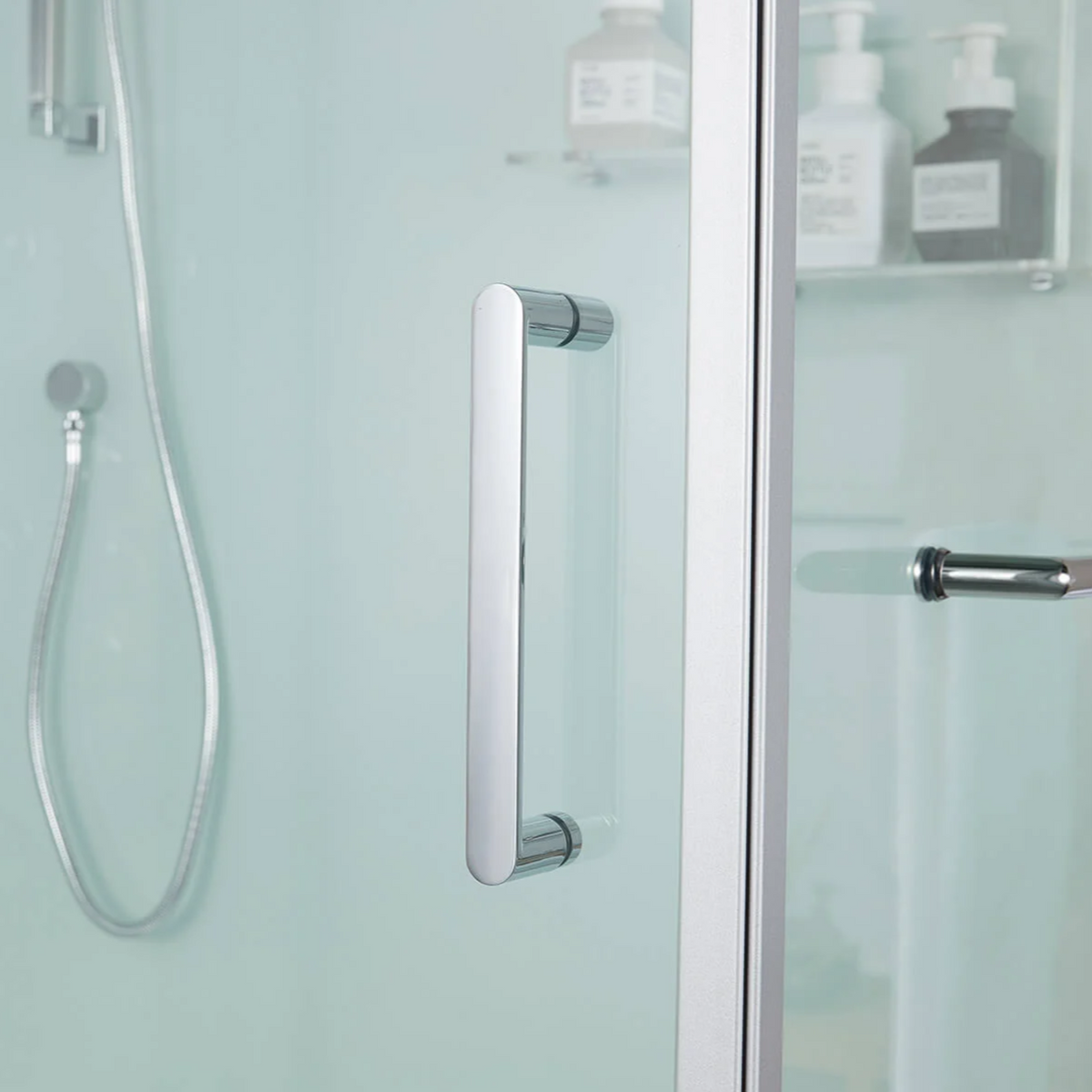 Close-up view of door handle of Maya Bath Anzio Steam Shower white version.