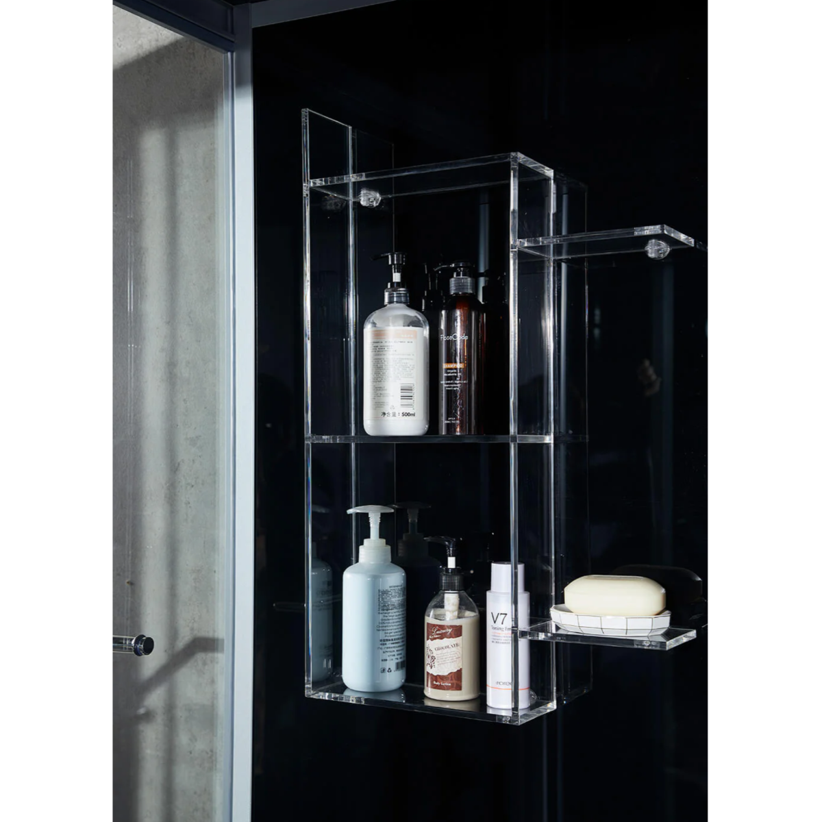 View of shampoo racks of Maya Bath Platinum Catania Steam Shower black version.