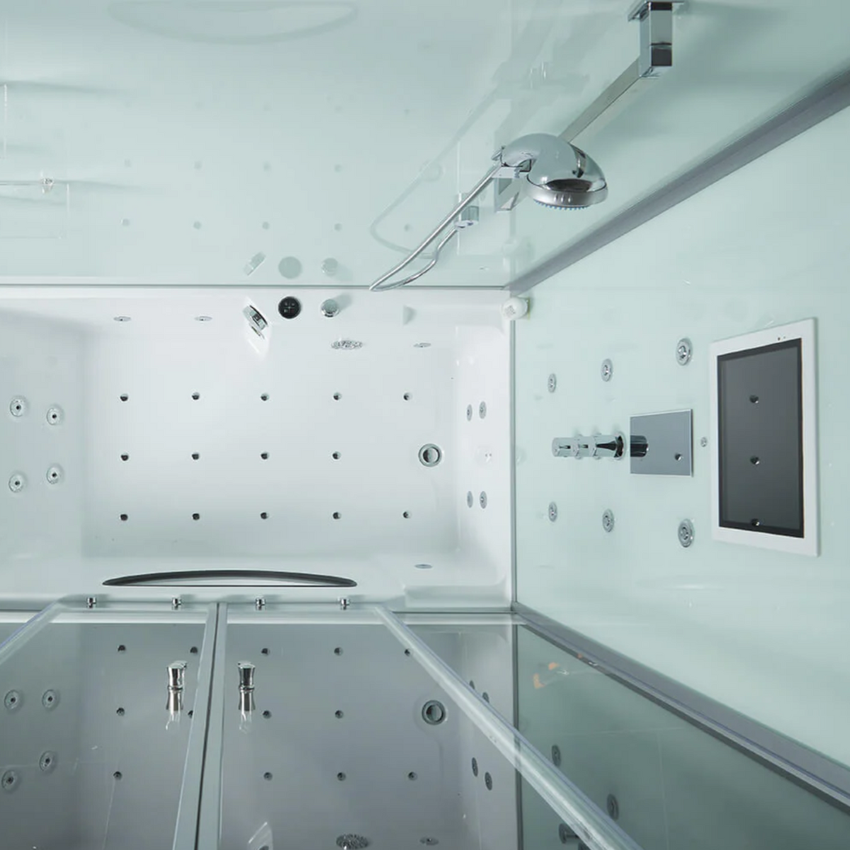 Interior view of Maya Bath Platinum Catania Steam Shower white version, showing the control panel, smart TV and massage jets. 