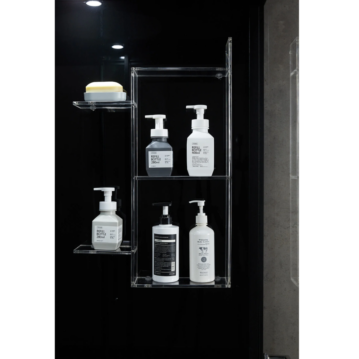 Storage shelves of Maya Bath Platinum Lucca Steam Shower black version.