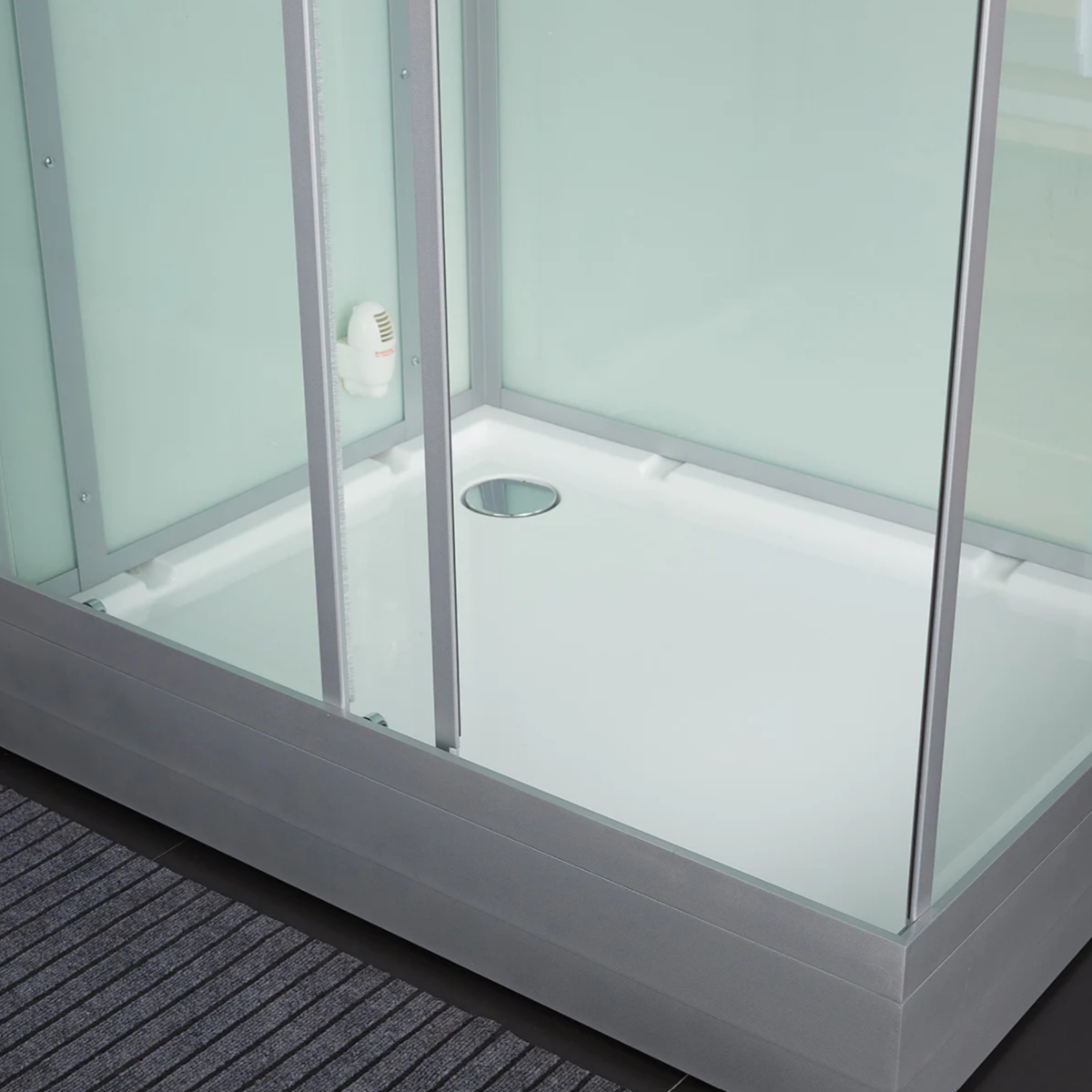 Close-up view of the floor of Maya Bath Platinum Lucca Steam Shower white version.