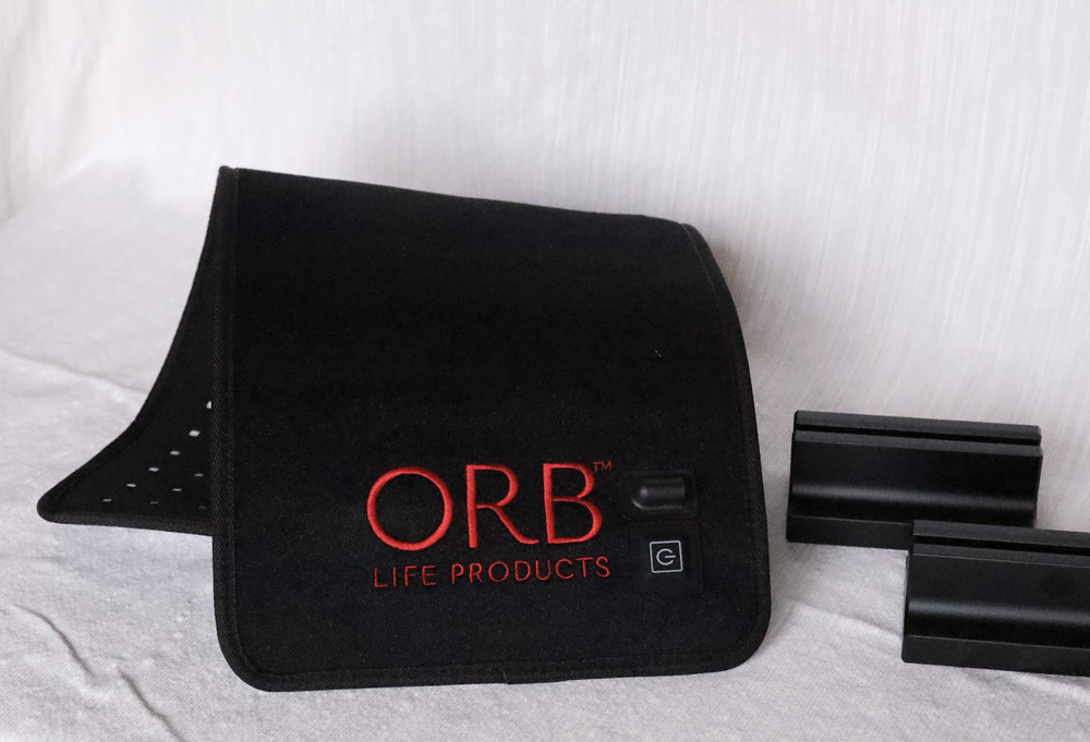 ORB Facial Light &amp; Therapy Wrap with distinctive branding, a leading solution for home-based red light therapy.