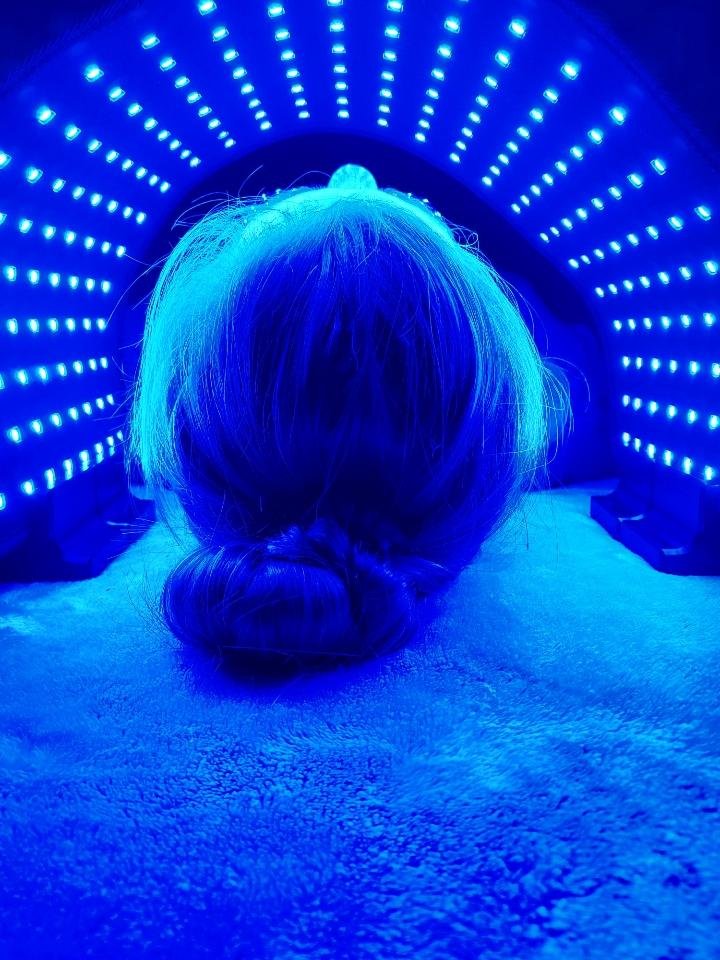 Relaxing blue light therapy session with ORB Facial Light &amp; Therapy Wrap for anti-aging and skin rejuvenation.