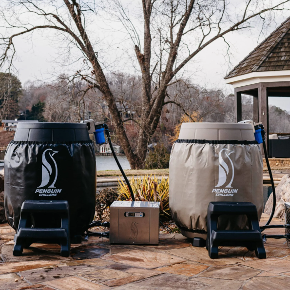 Outdoor setting featuring two Penguin Chillers insulated barrel wraps with chiller units.