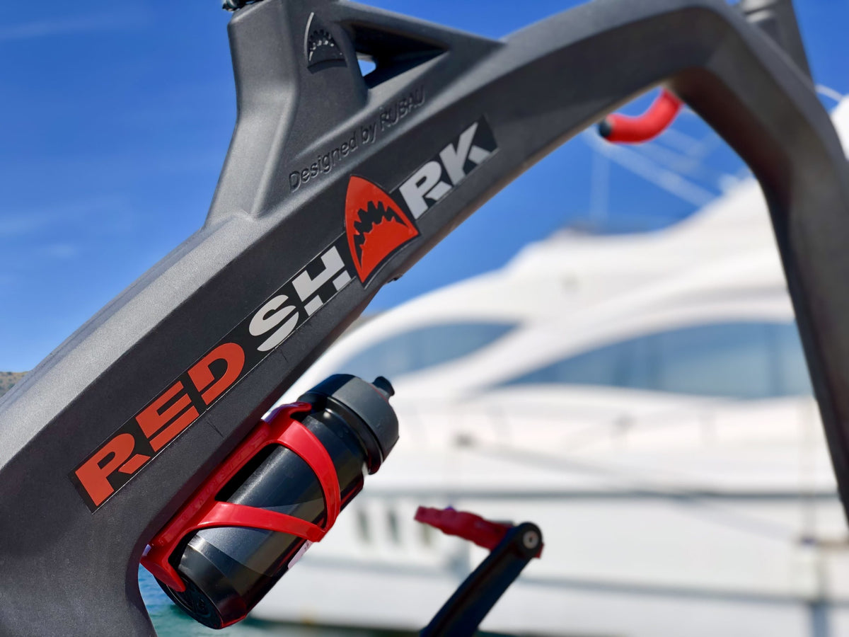 Close-up of a Red Shark Fitness Bike Surf highlighting the frame and water bottle.