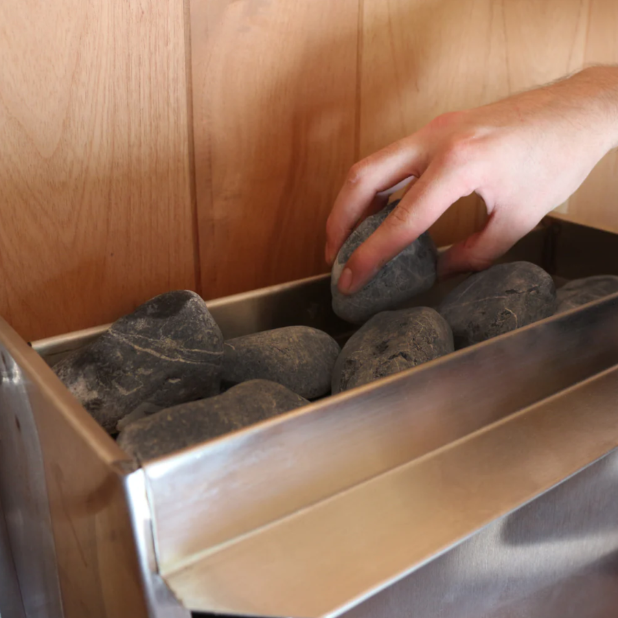 Close-up view of the heater of Scandia Electric Barrel Sauna.