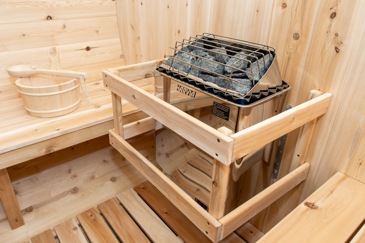 Close-up view of an electric heater installed in a Leisurecraft Canadian Timber Tranquility Outdoor Barrel Sauna.