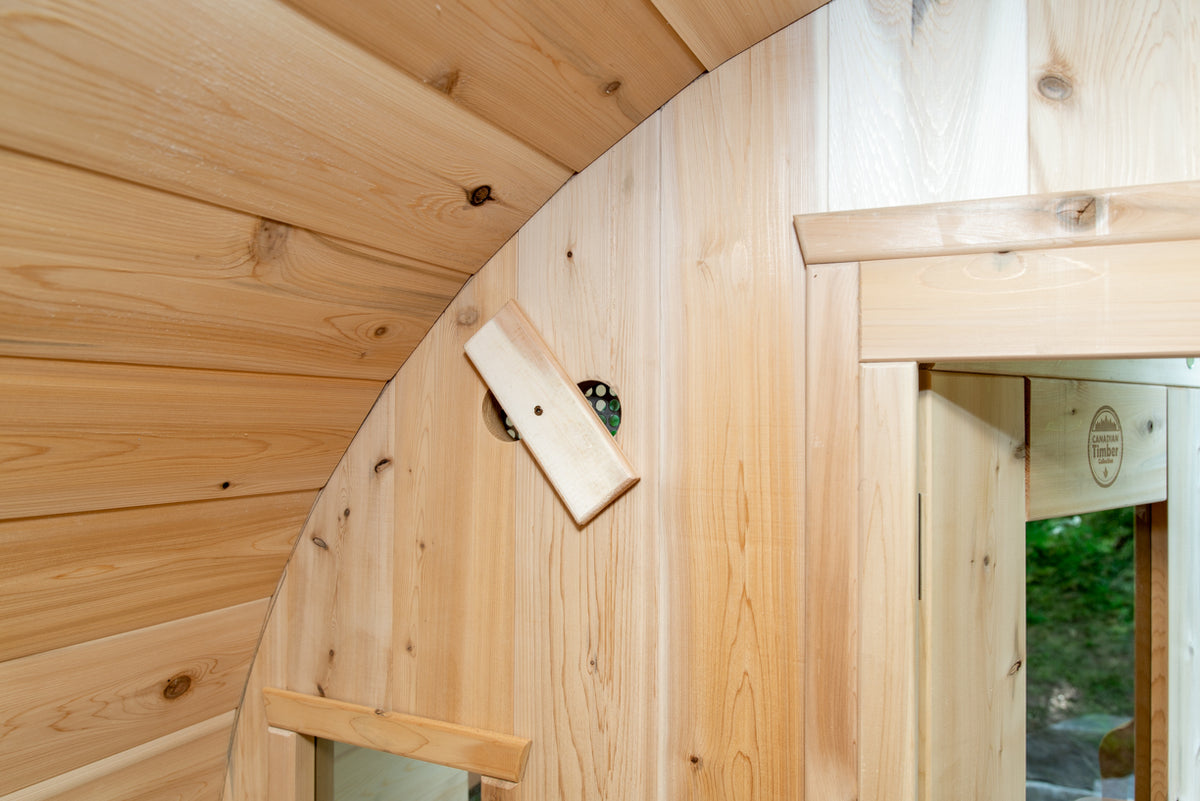 Close-up view of interior details of Leisurecraft Canadian Timber Tranquility Outdoor Barrel Sauna.