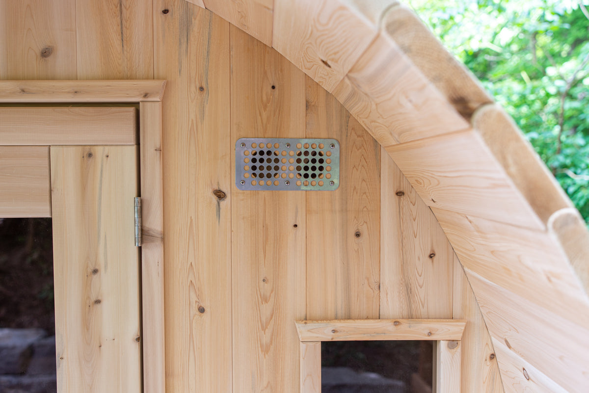 Close-up view of the details of the canopy porch of a Leisurecraft Canadian Timber Tranquility Outdoor Barrel Sauna.