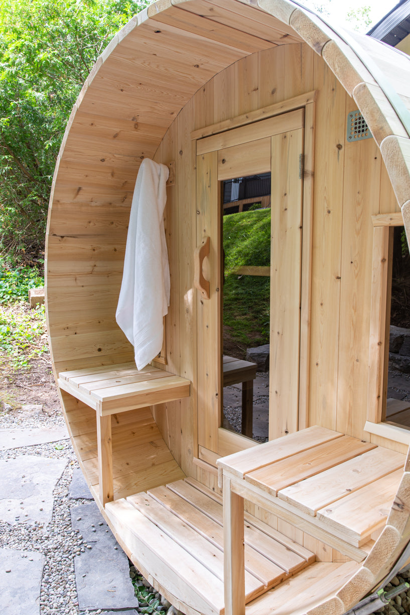 Close-up view of the windows at the canopy porch of Leisurecraft Canadian Timber Tranquility Outdoor Barrel Sauna.