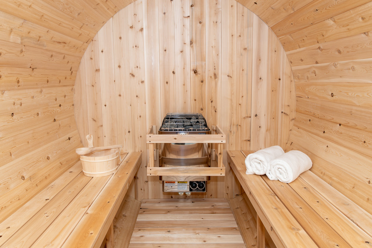 Close-up view of an electric heater installed in a Leisurecraft Canadian Timber Tranquility Outdoor Barrel Sauna.