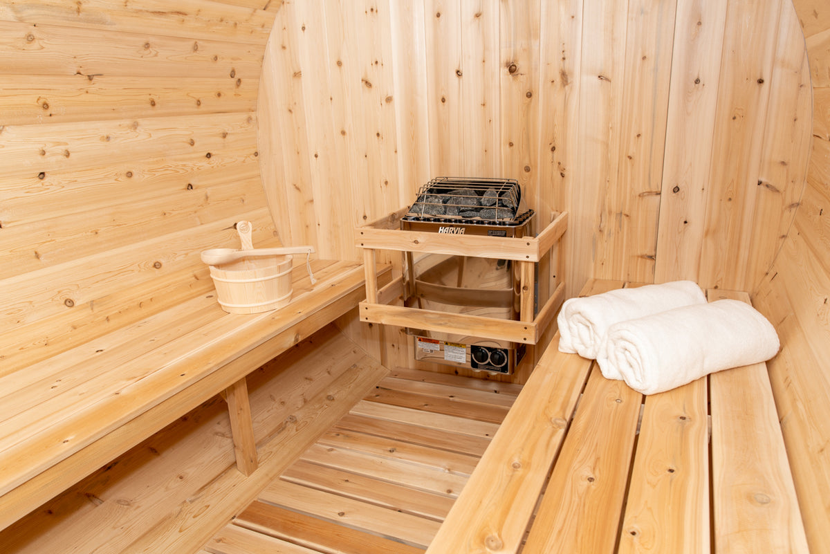 Close-up view of an electric heater installed in a Leisurecraft Canadian Timber Tranquility Outdoor Barrel Sauna.