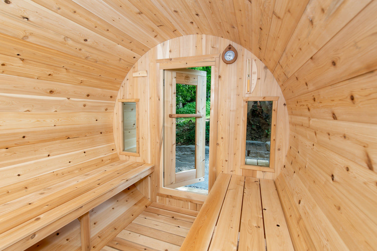 Interior view of Leisurecraft Canadian Timber Tranquility Outdoor Barrel Sauna, showing its spacious and elegant design.