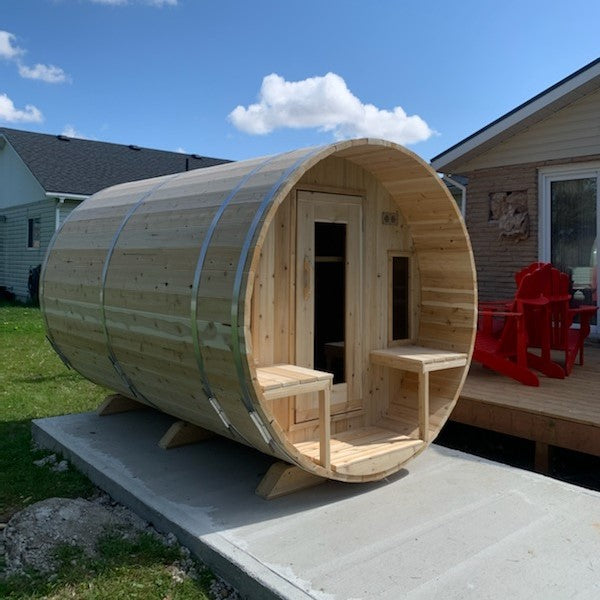 Leisurecraft Canadian Timber Tranquility Outdoor Barrel Sauna in an outdoor setting during a sunny day.