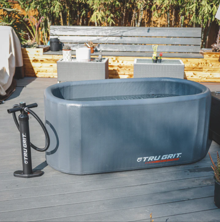 Tru Grit Inflatable Tub with Inflating Pump on Outdoor Setting.