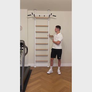 A video of a man using a BenchK 521 Wall Bars and Gymnastic Ladders.