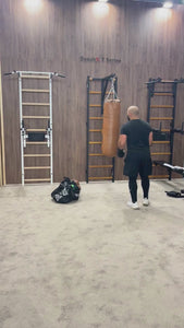 Video of a man training boxing with BenchK BBH Punching Bag Holder and a punching bag.